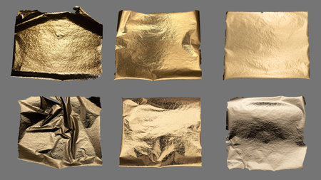 Torn and crumpled gold foil with metallic texture, fragile and rugged edges, shimmering brass and bronze material, rich and luxurious piece with crinkled, damaged, and textured finish, isolated.の写真素材