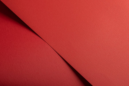 Red paper texture with vibrant fire red and scarlet tones, rough textured surface with punched geometric lines, bold abstract composition, clean, stylish finish for a premium, energetic backdrop.の写真素材