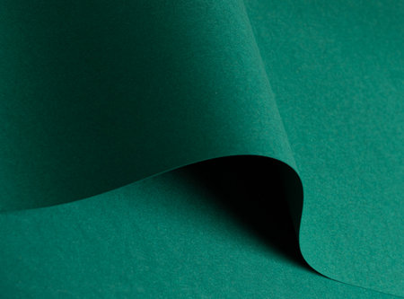 Green paper texture with vibrant emerald and jewel green tones, matte surface with curved folded edges, clean, smooth finish, modern minimalistic design and rich earthy contrast for an elegant,の写真素材
