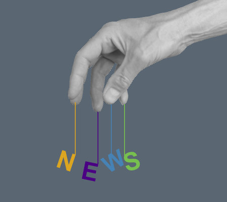 Hand manipulating information, symbolizing media control, disinformation, and fake news. Concept of propaganda, deception, and misinformation in journalism, with censorship and misleading messages.の写真素材