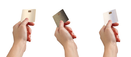 Hand extending a bank card for payment, fingers outstretched, showing credit or debit transaction....
