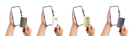 Hand holding a smartphone with a bank app for cashless payment, displaying a credit card for online...