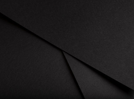 Black matte paper texture with a rich, premium finish, featuring simple geometric lines and an abstract design. Chic, minimalistic backdrop perfect for trendy fashion and stylish decor.の写真素材