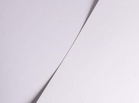 Chic off-white paper texture with a matte finish. Elegant, minimalistic abstract pattern creating a stylish, trendy backdrop. Expensive material with a smooth surface, perfect for fashion or decor.の写真素材