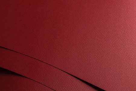 Dark burgundy matte paper texture with a sleek, modern finish, featuring simple geometric lines and a minimalistic design. Chic, premium material perfect for trendy fashion and stylish decor.の写真素材