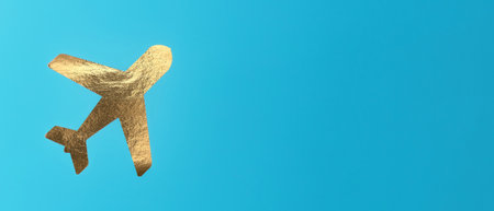 A small airplane flying in the sky, golden foil, banner . Concept of travel, aviation, and advertising, with a cute, pastel background. Aviation, tourism, and leisure trip idea for business orの写真素材