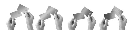 Bank card held in hand. Premium, elegant plastic credit and debit cards in gray, black, grayscale tones. Online payment, transfer, shopping, purchase, finance, and commercial concept. Set for retail,の写真素材