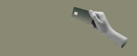 Bank card held in hand, showing credit and debit features. Modern finance, electronic payment, and...