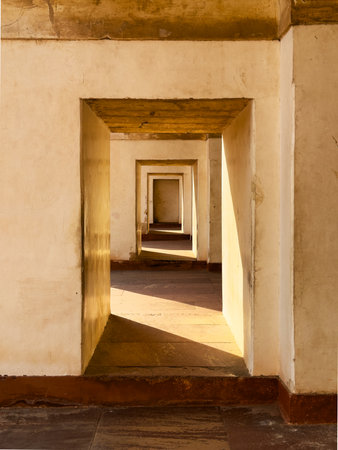 Ancient sandstone portal with arch, creating a passage through time. Symmetrical doorway, light and...