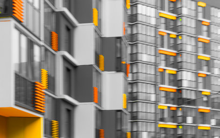 Colorful apartment building with orange, yellow, and gray facade. Blurry vertical structure in urban...