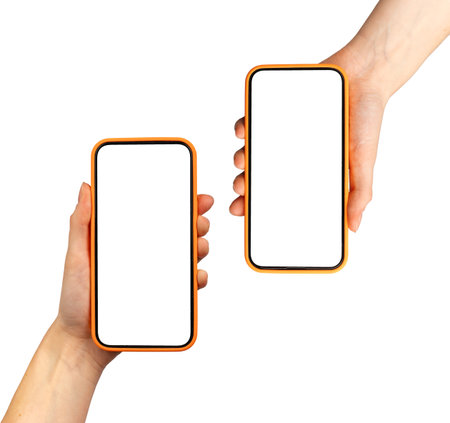 Hand holding two smartphones showing app screen. Mobile cellular devices with technology display. Smart phone pair mockup isolated on white background.の写真素材