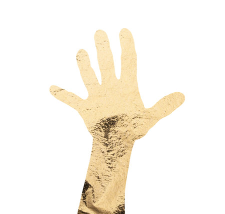 Hand with open palm gesture in gold foil texture. Expressive symbol of greeting, help, communication and attention with shiny metallic surface and artistic statement. Isolated on white background.の写真素材