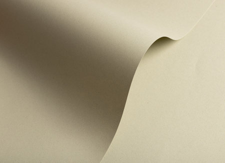 Beige and green speckled recycled paper with a rough, raw texture, offering an earthy, organic feel. The smooth matte surface creates a minimalistic, elegant backdrop, ideal for artistic and ecoの写真素材