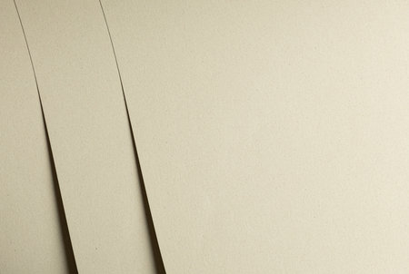 Muted beige and green recycled designer paper with speckled texture. Raw, rough cardboard surface, elegant matte finish. Simple, minimalistic backdrop, earthy, organic, eco friendly material. Idealの写真素材