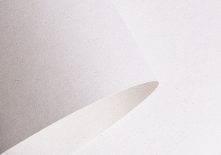 Soft, smooth white paper with a subtle speckled and mottled texture, made from recycled fiber. The vintage, handmade design features a natural, neutral tone, ideal for minimal and organic wrapping orの写真素材