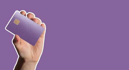 Card and payment concept. Female client holding plastic bankcard in hand for credit, debit, or cash transfer. Secure financial service, currency exchange, smart shopping.の写真素材