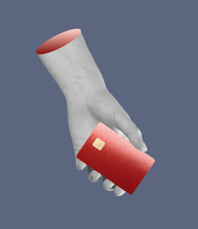 Card in hand. Human finger holding plastic bank card, warning of scam, phishing, and theft risk. Concept of security, transaction, and business spending. Payment, economy, consumer protection.の写真素材