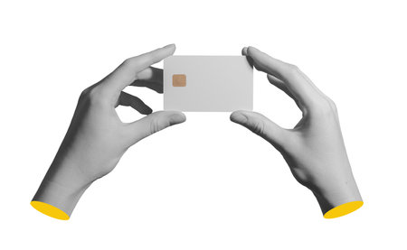 Bank card with electronic chip is held by fingers isolated on plain backgroundの写真素材