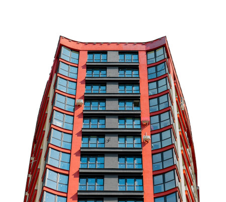 Contemporary multistory residential building with balconies and glass facade in developing metropolitan neighborhood. Tall condominium tower with modern design, isolated on white background.の写真素材
