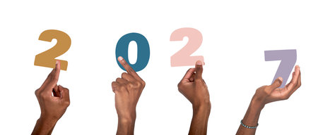 Black male hands group holding colorful 2027 number in festive New Year celebration. isolated on white background.の写真素材