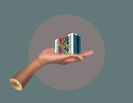 Building in hand real estate concept. African male holding modern high rise apartment collage, showing property investment, urban development, commercial architecture and residential housing promotionの写真素材