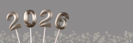 2026 New Year banner. Shiny silver and platinum numbers glowing with festive light, elegant metallic...