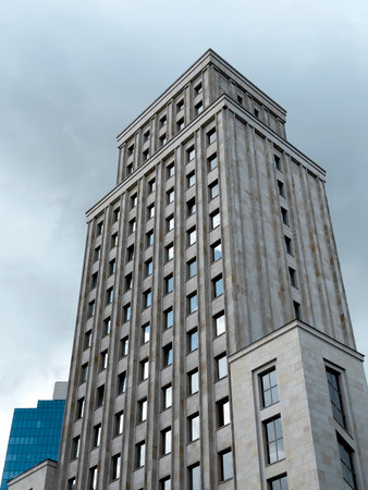 Modern high-rise building. skyscraper with comcrete facade and vertical architecture, symbol of urban development, corporate growth, and real estate investment in a metropolitan city landscape.の写真素材