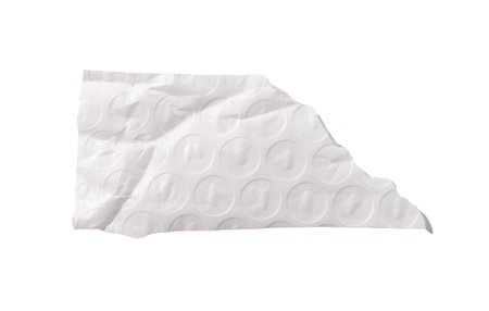 A wide torn piece of bubble wrap with visible circular texture, creases, and uneven edges, isolated...