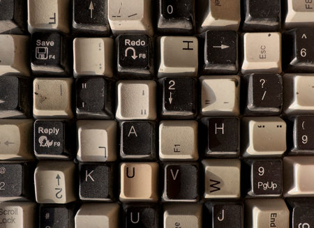 vintage computer keyboard keys with worn letters symbols and dust texture. Retro input device...