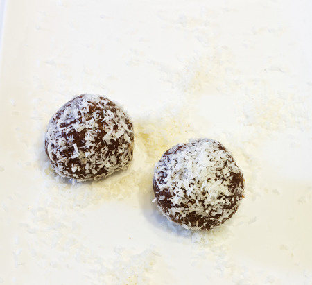Chocolate balls - topped with grated coconut .の写真素材