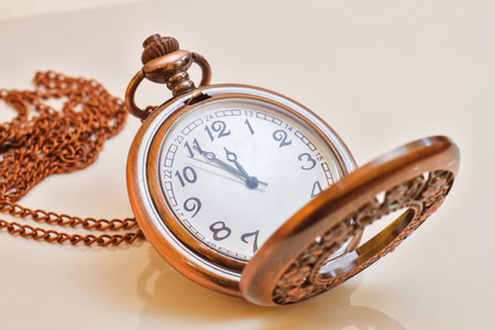 Beautiful photos of vintage watches on a chain. Isolated on white.