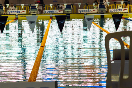 Wingate Institute , Israel - May 17 , 2014 : International swimming competition among juniors. Beautiful photo of a swimming pool. Swimmers in lanes.のeditorial素材
