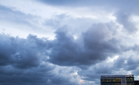 Storm clouds against the blue sky in the evening .