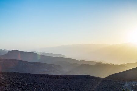 Early morning in ancient mountains of Sinai desert. Sunrise over Red seaの写真素材