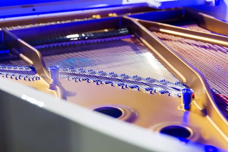 Close-up of piano strings. open the piano lid .の写真素材