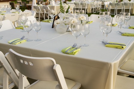 Table set for wedding or another catered event dinner .
