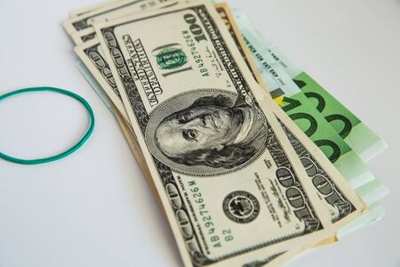 Currency and elastic band on white background .の写真素材