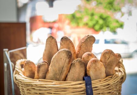 a group of baguette on a wood basketの写真素材