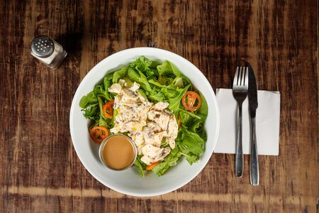 a fresh salad with nice dressingの写真素材