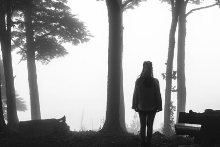 a woman looking at the blank horizonの写真素材