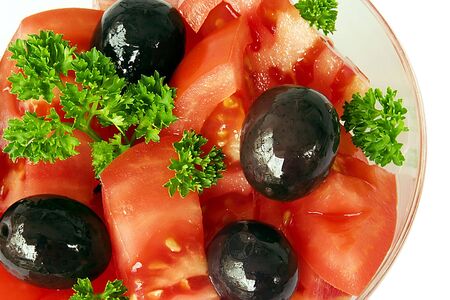 black olives with red tomatoes and green parsleyの写真素材