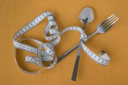 fork and spoon fixed by measuring tape
