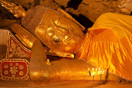 Reclining Buddha image in the cave of light, Petchaburi, Thailand.の写真素材