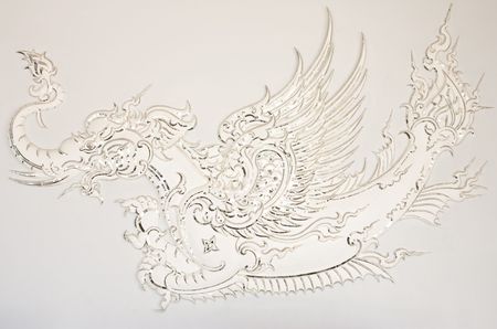 Fairy tale bird in traditional Thai art, Wat Rong Khun, Chaing Rai, Thailandの写真素材