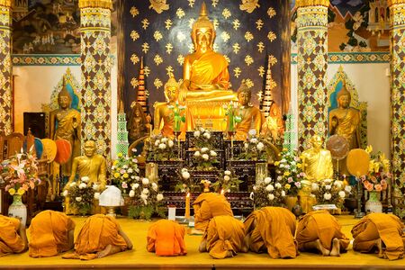 Monk and praying in churchの写真素材