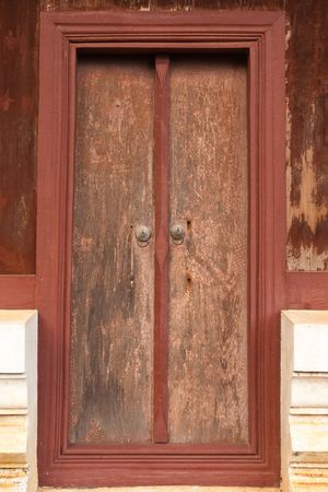 Old wood door in traditional Thai syleの写真素材
