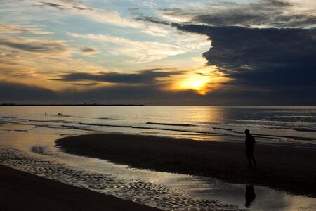 Jogging in the morning, Cha Am beach, Thailandの写真素材