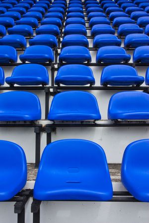 Row of blue seats in stadiumの写真素材