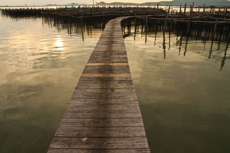 Wood bridge to fisherman house in sea, Yor island, Thailandの写真素材