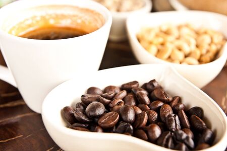 White coffee cup and coffee seedsの写真素材